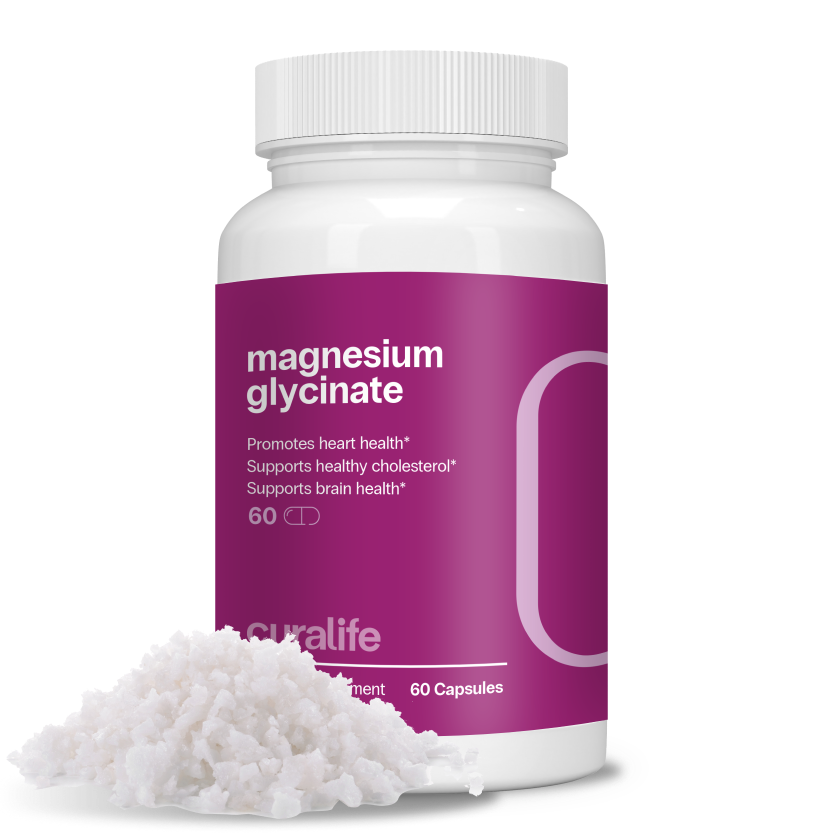 A bottle of Magnesium Glycinate capsules next to a pile of the powder.